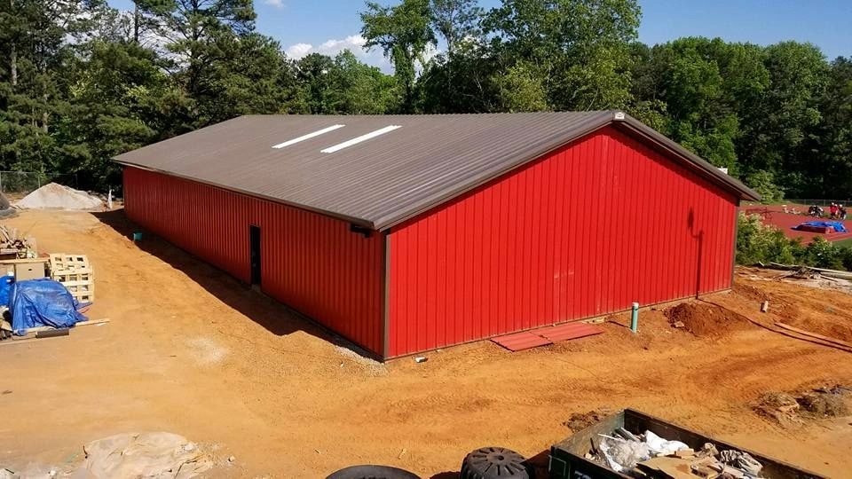 Red metal barn construction in rural Georgia